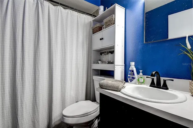 a bathroom with a sink and a toilet