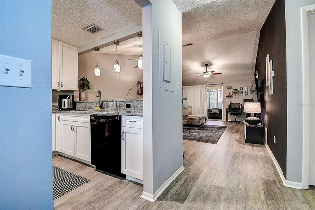 a view of a kitchen from the hallway