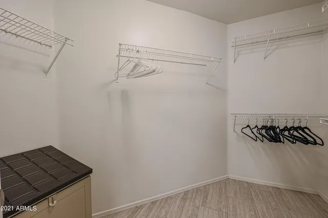 a view of a storage and utility room with racks on the wall