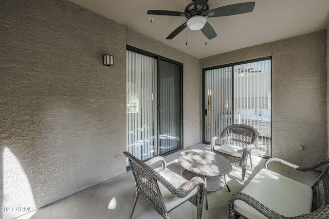 a dining room with furniture and window