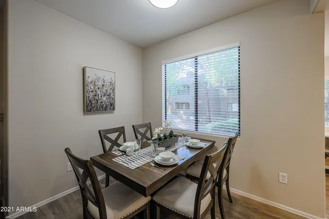 a view of a dining room with furniture window and wooden floor