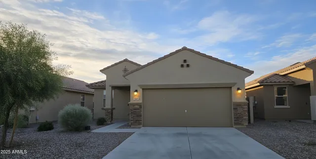 a front view of a house with garden