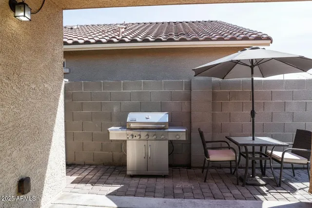 a utility room with a table and chairs