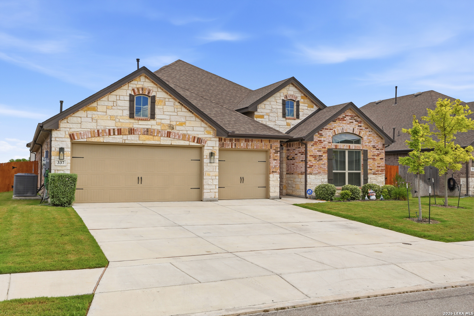 337 Misty Sails Cibolo, TX 78108 - Photo 4 of 50 a front view of a house with a yard and garage