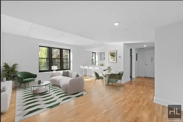 a bedroom with furniture and wooden floor