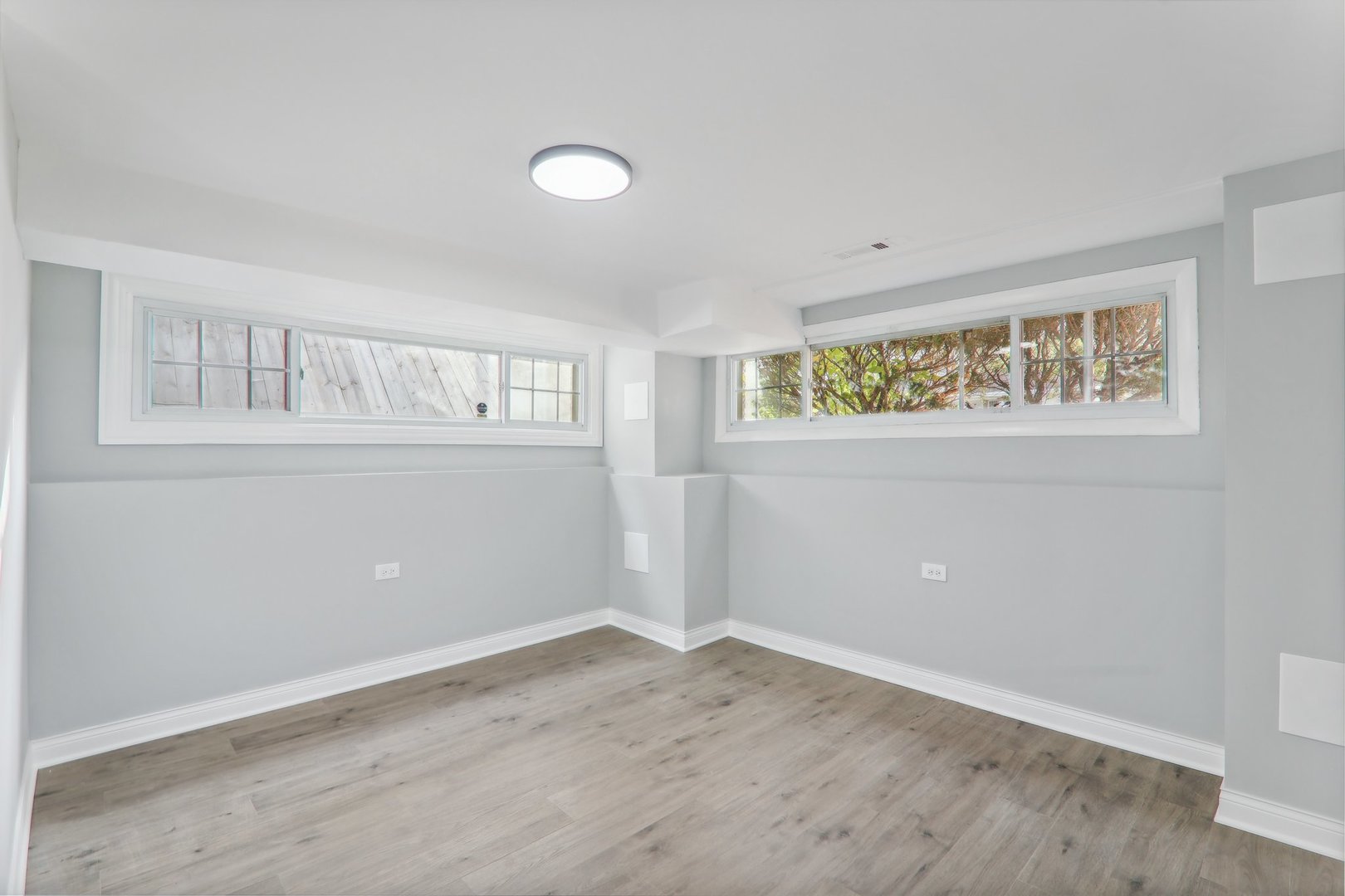3120 173rd Street Hazel Crest, IL 60429 - Photo 20 of 24 an empty room with wooden floor and windows