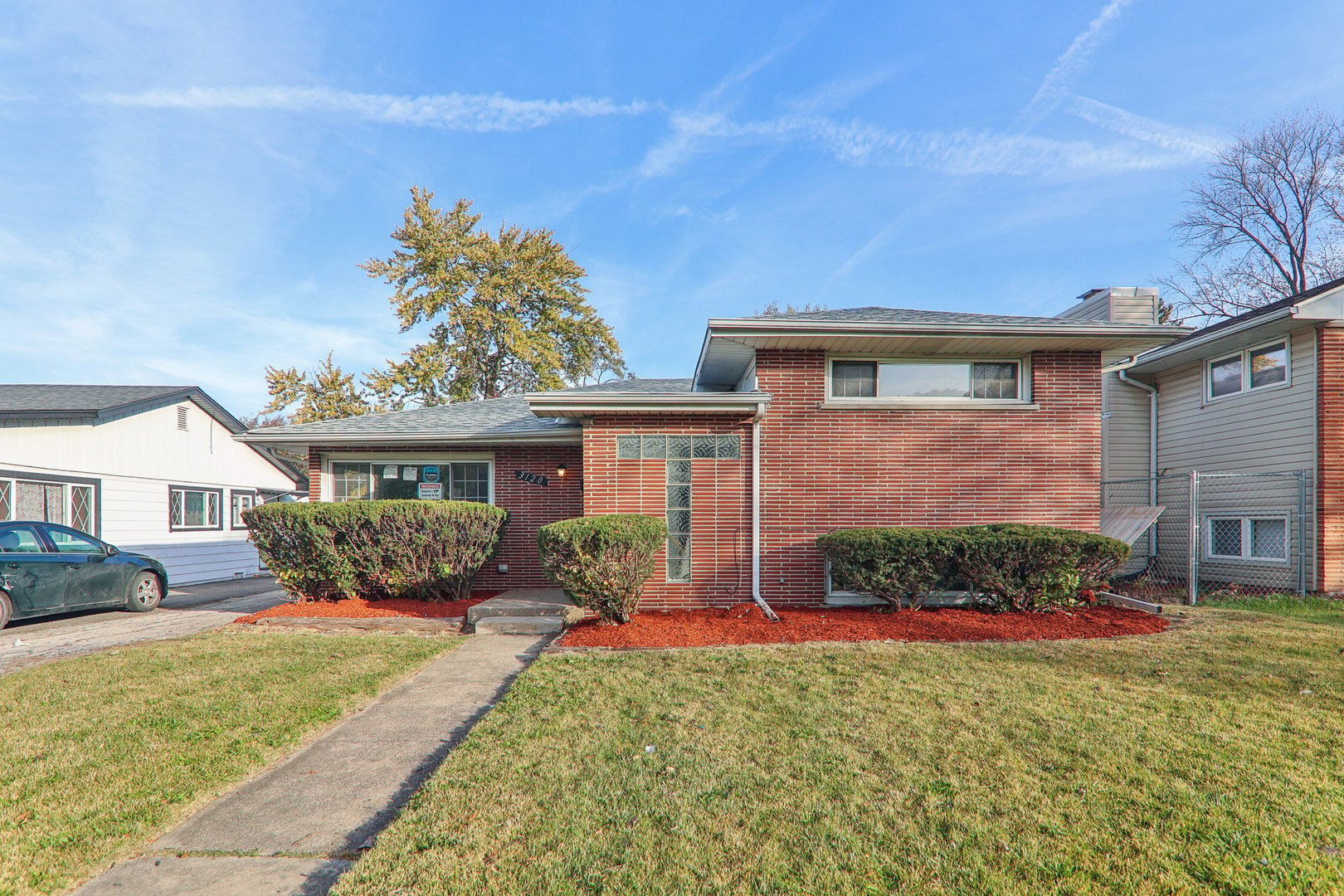3120 173rd Street Hazel Crest, IL 60429 - Photo 2 of 24 front view of a house with a yard
