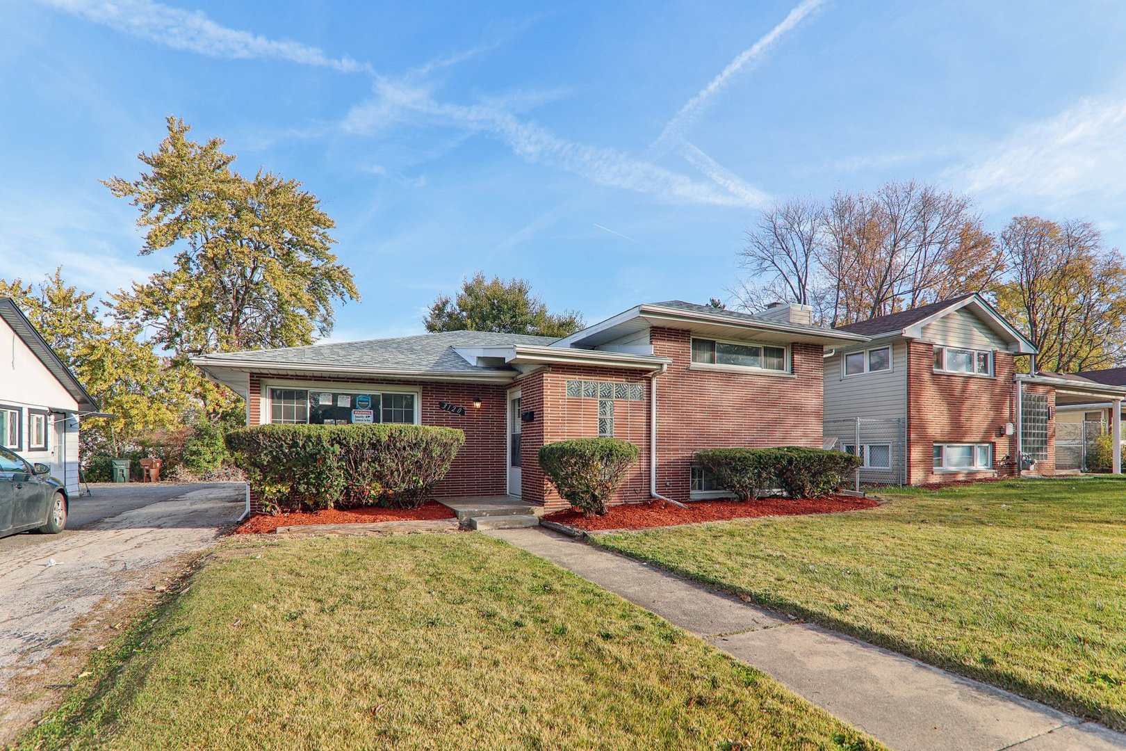 3120 173rd Street Hazel Crest, IL 60429 - Photo 3 of 24 a front view of a house with garden