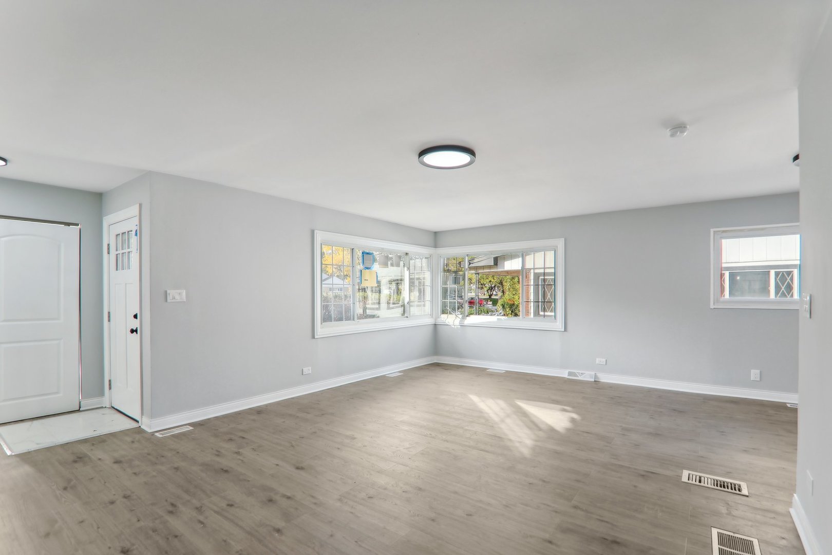 3120 173rd Street Hazel Crest, IL 60429 - Photo 5 of 24 a view of an empty room with a window