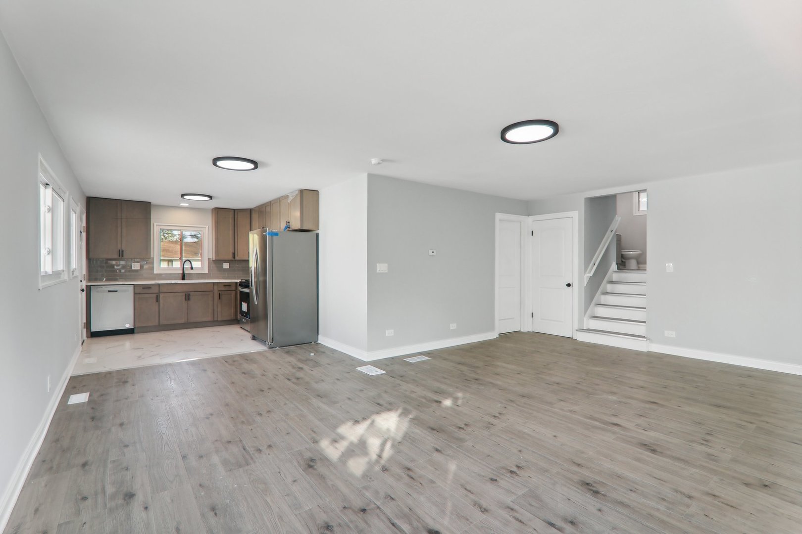 3120 173rd Street Hazel Crest, IL 60429 - Photo 7 of 24 a view of a kitchen with a sink and a refrigerator