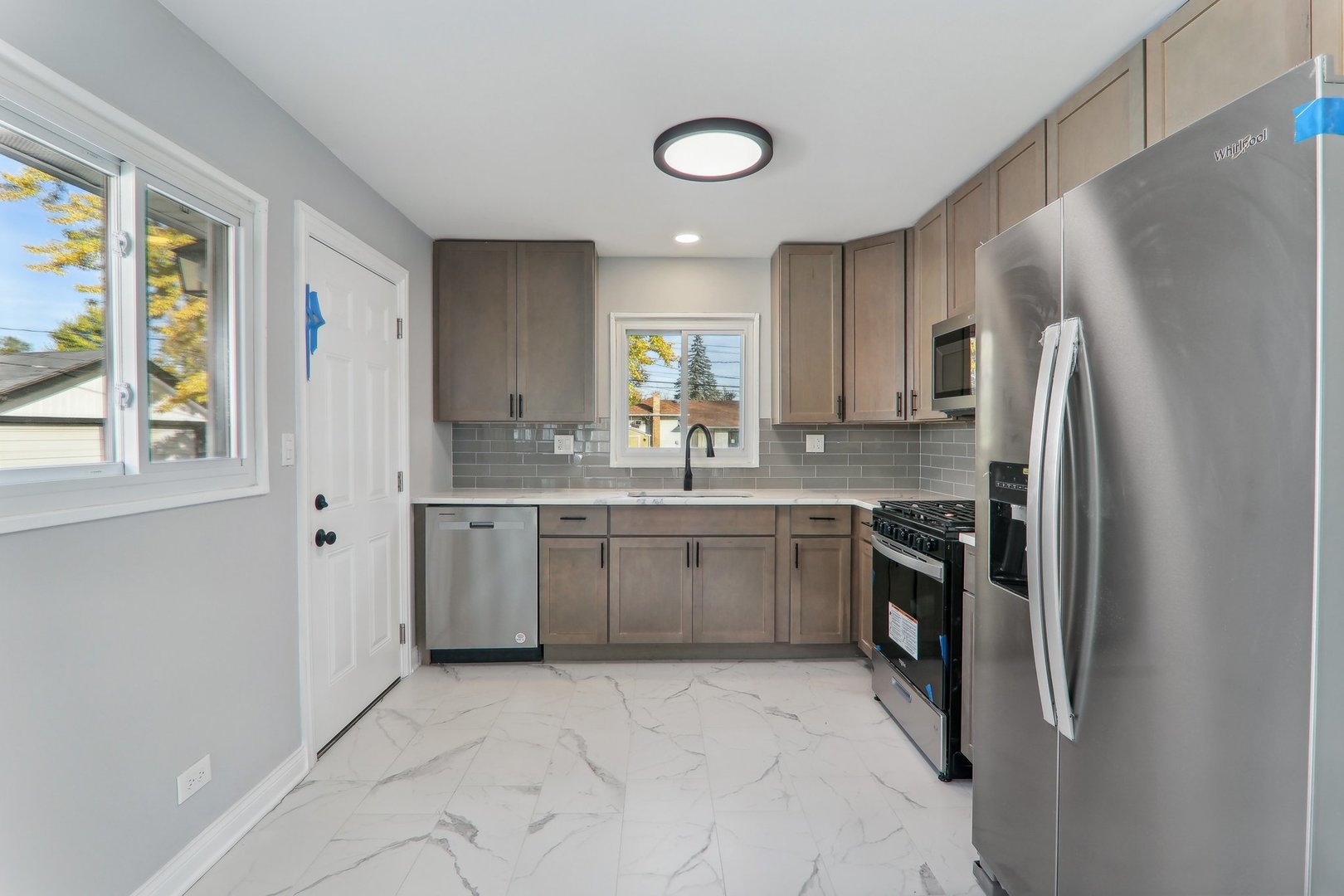3120 173rd Street Hazel Crest, IL 60429 - Photo 10 of 24 a kitchen with a refrigerator sink and stove