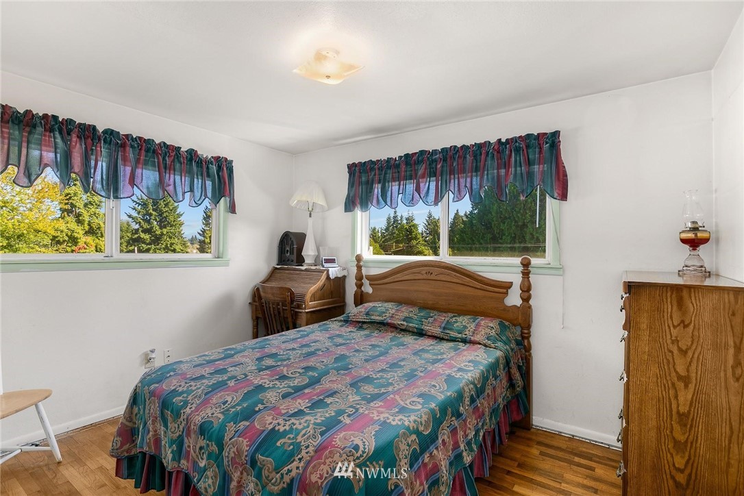 1617 Ludwig Road Snohomish, WA 98290 - Photo 14 of 31 a bedroom with a bed window and painting on the wall