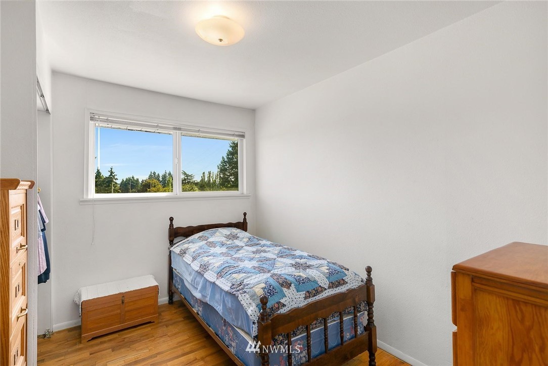 1617 Ludwig Road Snohomish, WA 98290 - Photo 16 of 31 a bedroom with a bed and wooden floor