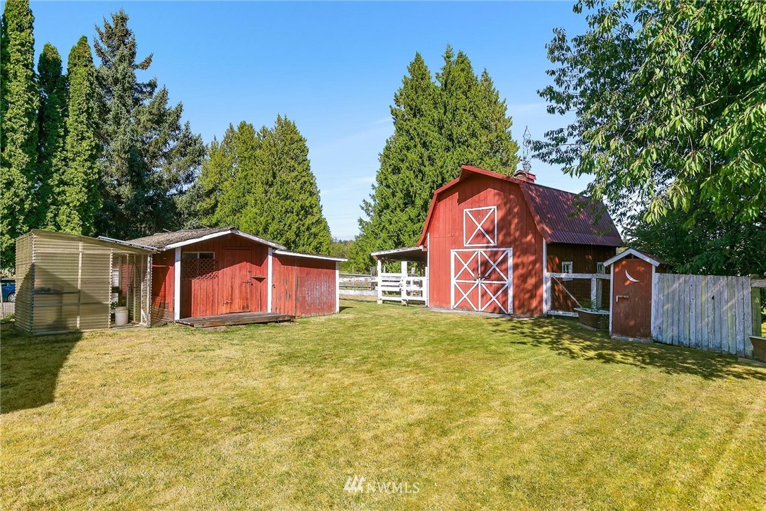 1617 Ludwig Road Snohomish, WA 98290 - Photo 20 of 31 a view of a house with a yard and large tree
