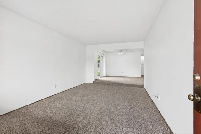 a kitchen with a sink a stove and cabinets