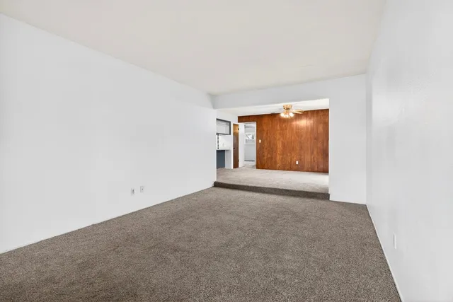 a bathroom with a sink a toilet a mirror a bathtub and shower