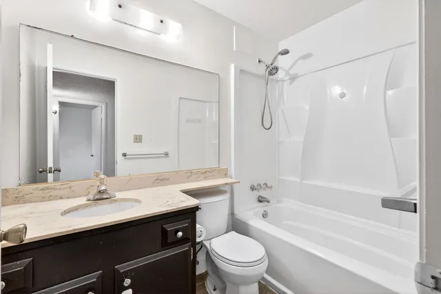 a view of house with backyard