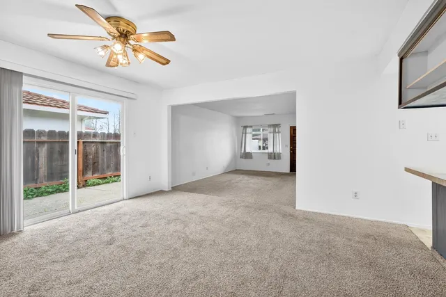 a front view of a house with garden and lake view