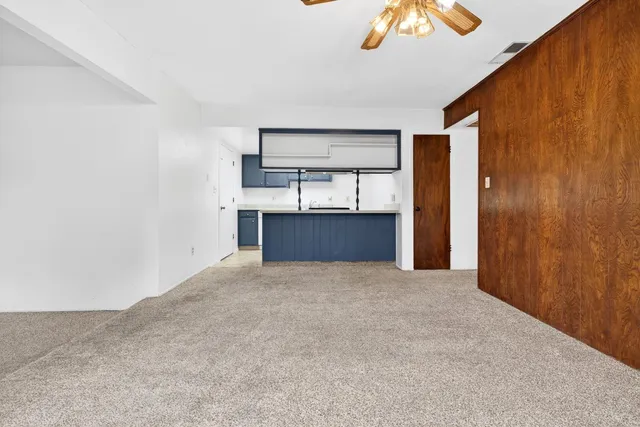 a kitchen with sink a stove and cabinets