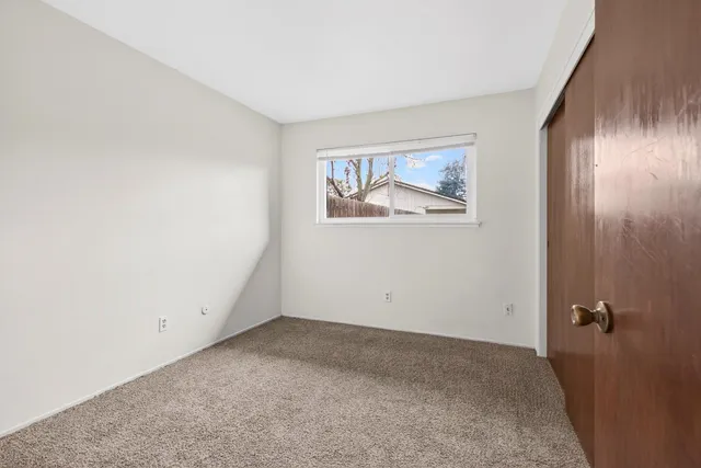 a bathroom with a sink a toilet a mirror a vanity and shower