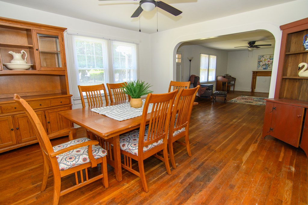 24432 Maxwell Street Parksley, VA 23421 - Photo 10 of 39 a view of a dining room with furniture and wooden floor