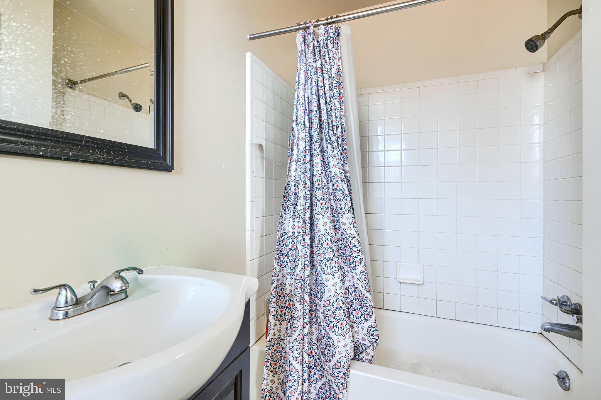 3218 Belair Road Baltimore, MD 21213 - Photo 16 of 26 a bathroom with a shower and a sink
