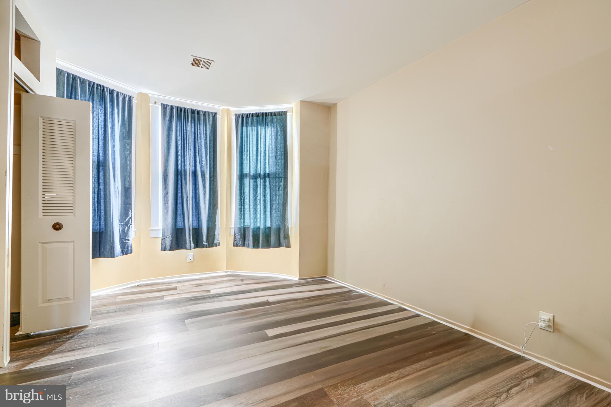 3218 Belair Road Baltimore, MD 21213 - Photo 17 of 26 a view of wooden floor and closet in a room