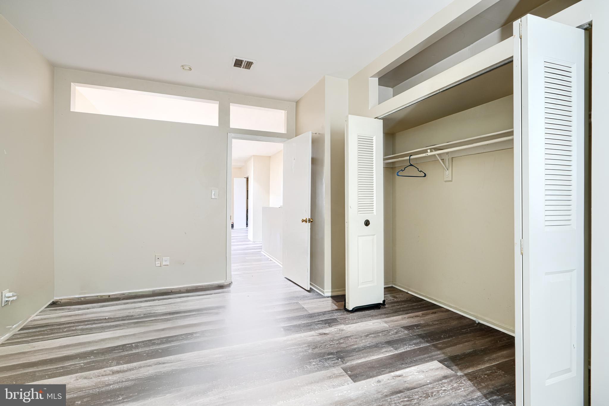3218 Belair Road Baltimore, MD 21213 - Photo 18 of 26 a view of a room with wooden floor and a window