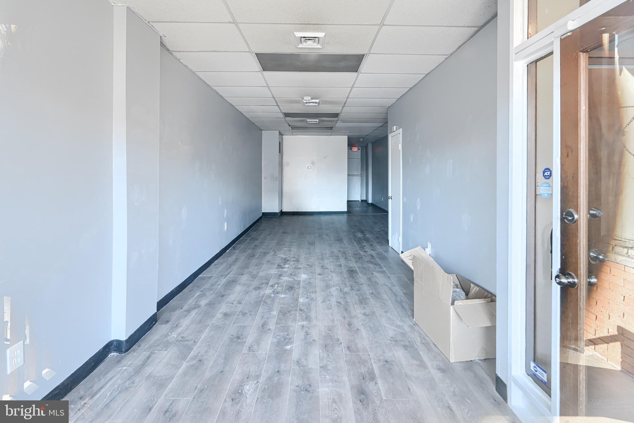 3218 Belair Road Baltimore, MD 21213 - Photo 7 of 26 a view of a hallway with wooden floor and staircase