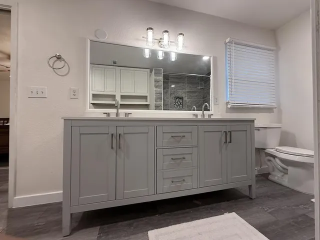 a bathroom with a sink and shower