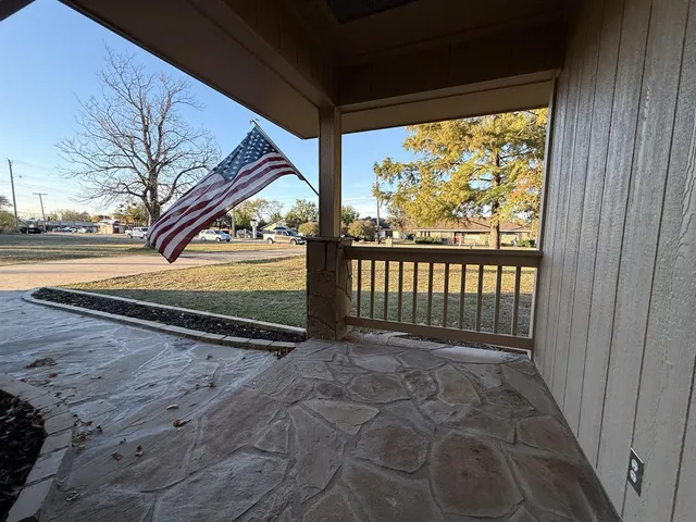a view of dining room with kitchen island stainless steel appliances wooden floor