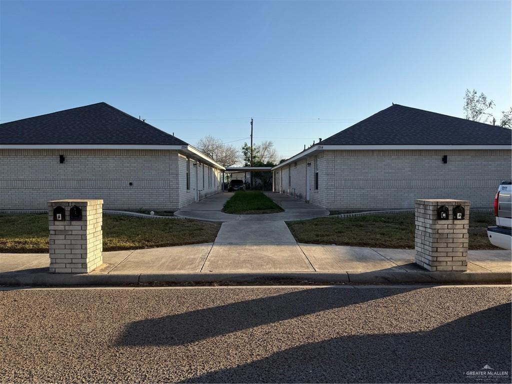 1914 Summer Breeze Road, Unit D Mission, TX 78572 - Photo 1 of 10 a front view of a house with garage