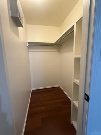 a view of a utility room with wooden floor