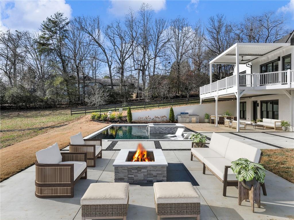 5651 Old Wilkie Road Gainesville, GA 30506 - Photo 59 of 65 a view of a swimming pool with couches and lounge chair