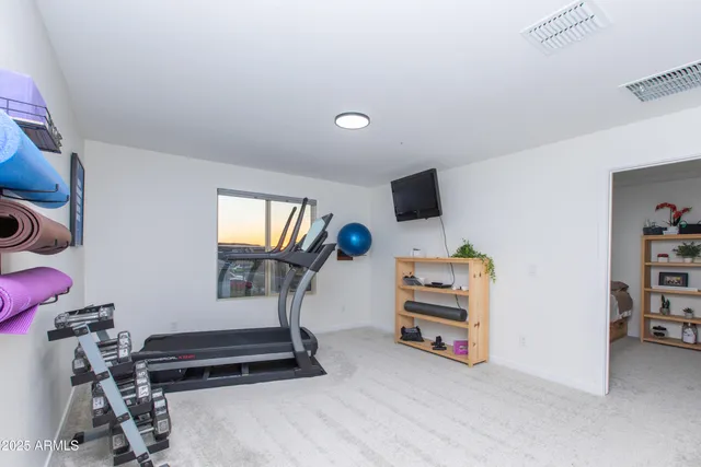 a room with furniture and a flat screen tv