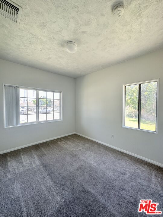 Undisclosed Address Azusa, CA 91702 - Photo 13 of 31 an empty room with a empty space and windows