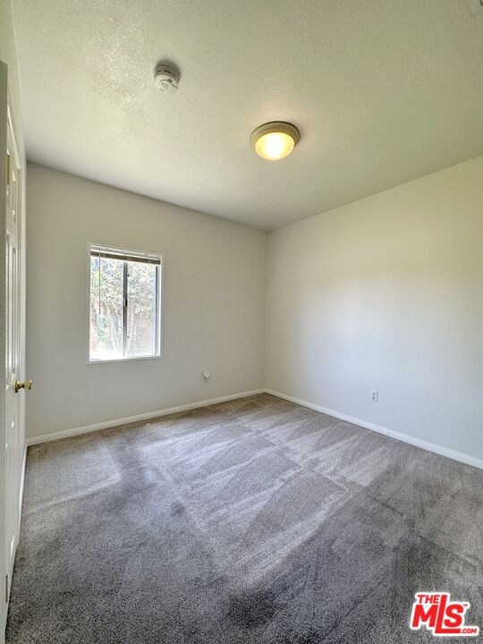 Undisclosed Address Azusa, CA 91702 - Photo 16 of 31 an empty room with a empty space and windows