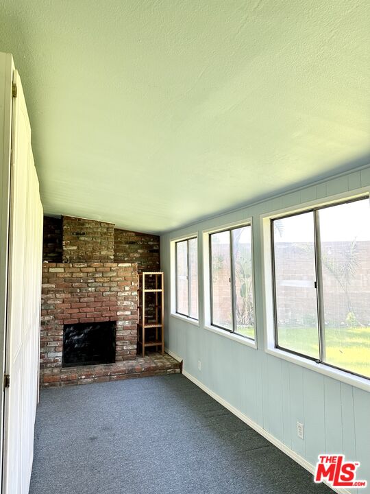 Undisclosed Address Azusa, CA 91702 - Photo 28 of 31 an empty room with windows and fireplace