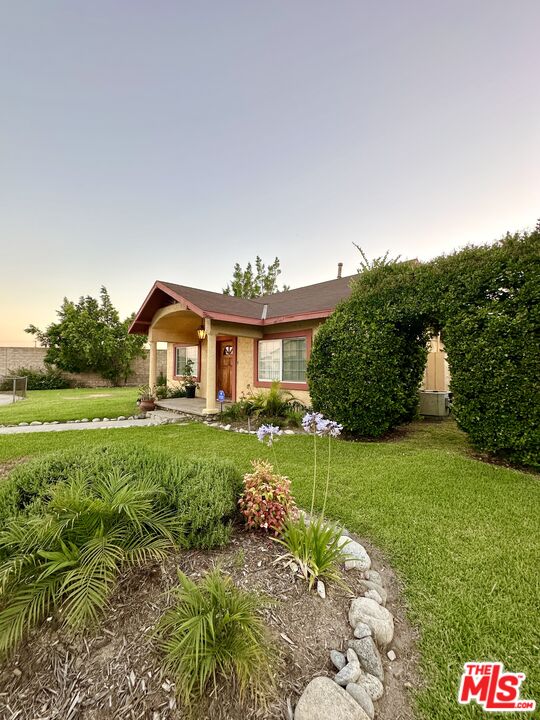 Undisclosed Address Azusa, CA 91702 - Photo 31 of 31 a front view of a house with garden