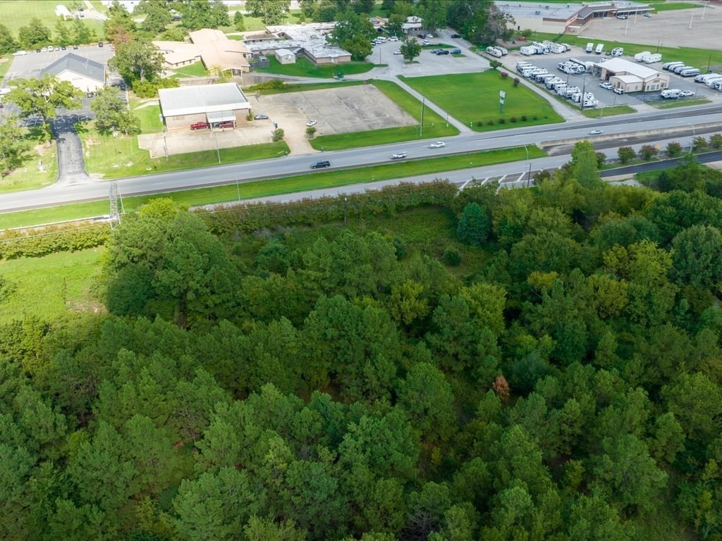 601 North John Redditt Drive Lufkin, TX 75904 - Photo 11 of 13 a green field with lots of tress in it