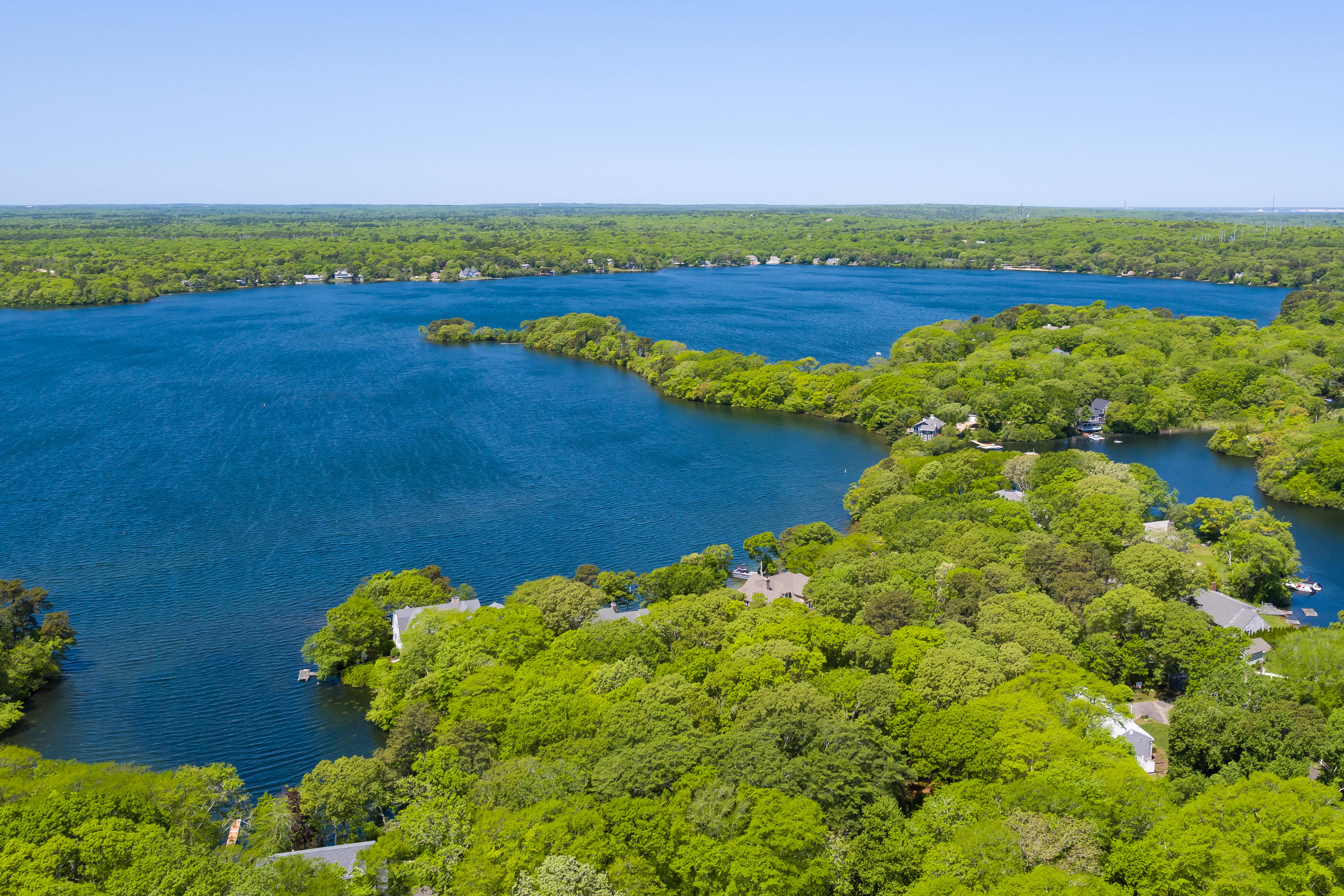 326 Holly Point Road Centerville, MA 02632 - Photo 24 of 30 a view of a lake with a big yard