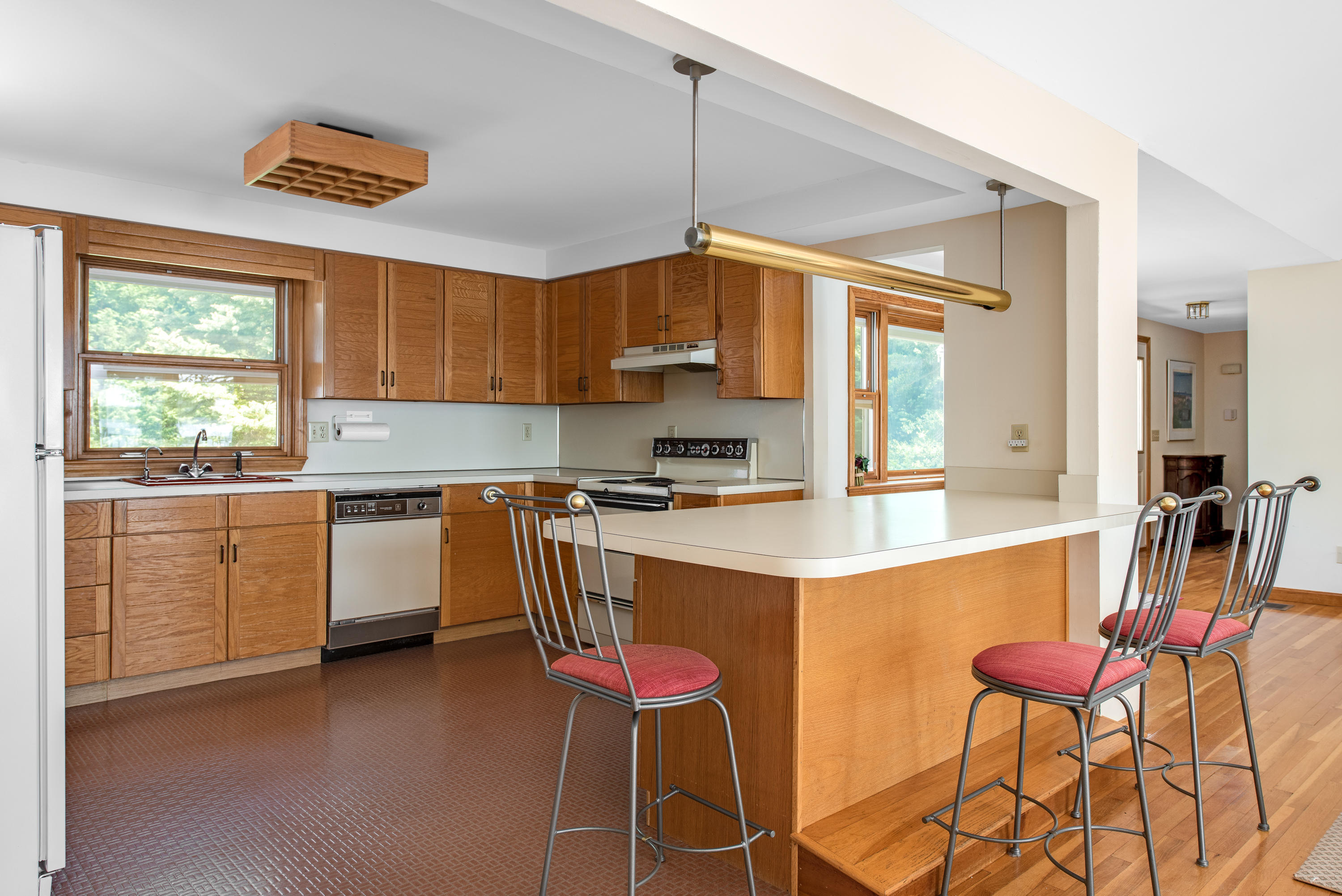 326 Holly Point Road Centerville, MA 02632 - Photo 4 of 30 a kitchen with a sink cabinets and window