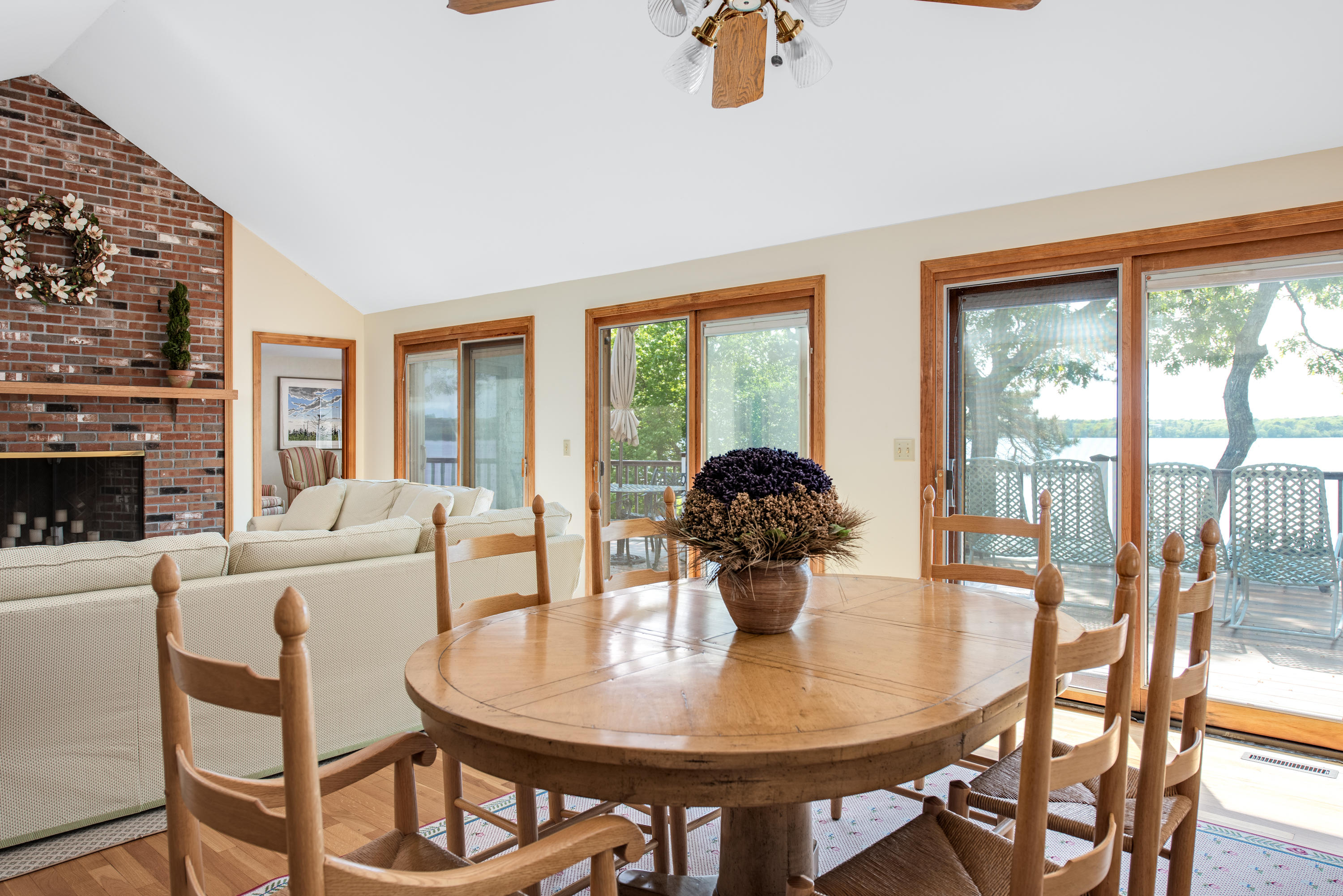 326 Holly Point Road Centerville, MA 02632 - Photo 5 of 30 a living room with fireplace furniture and a table