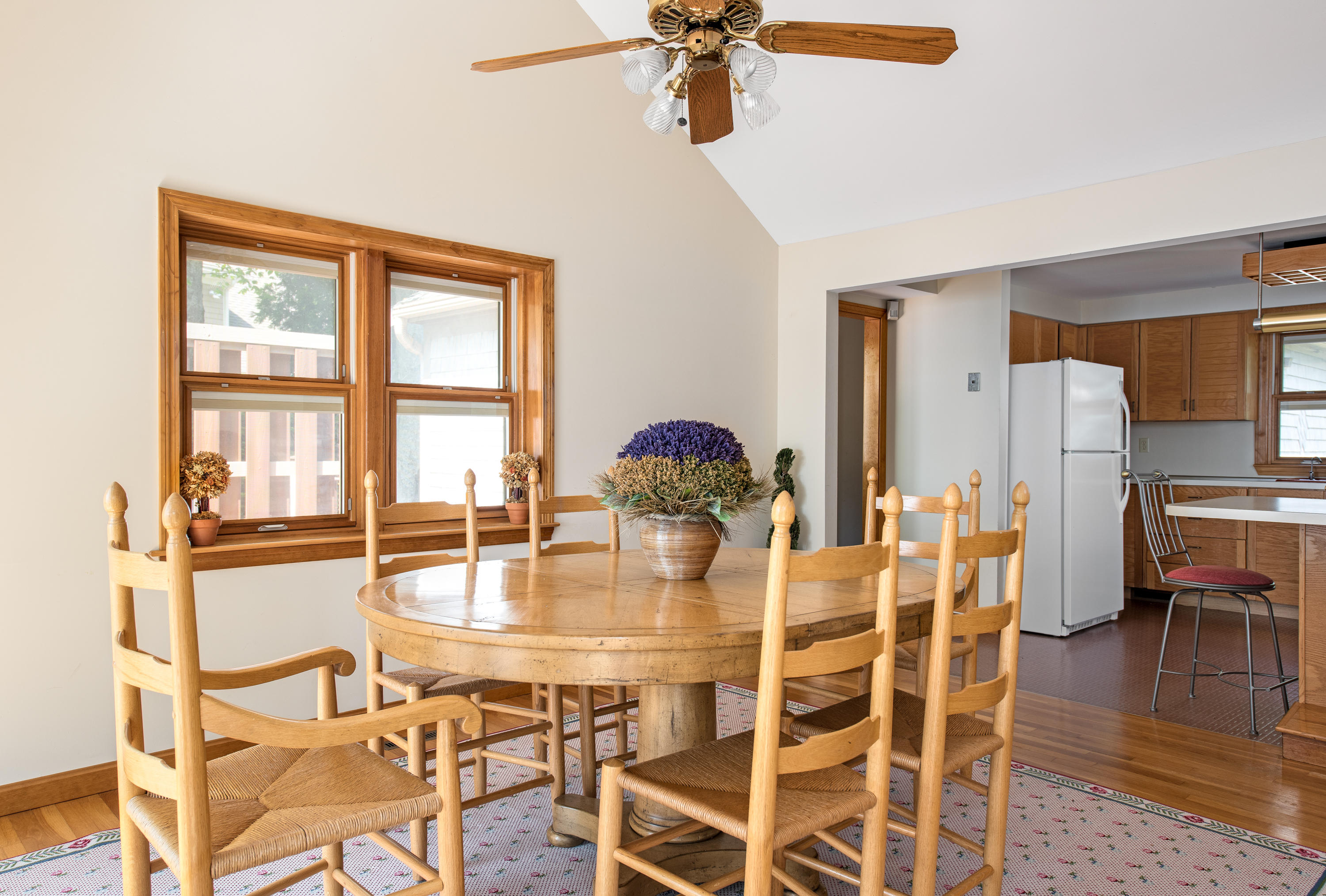 326 Holly Point Road Centerville, MA 02632 - Photo 6 of 30 a dining room with furniture a chandelier and wooden floor