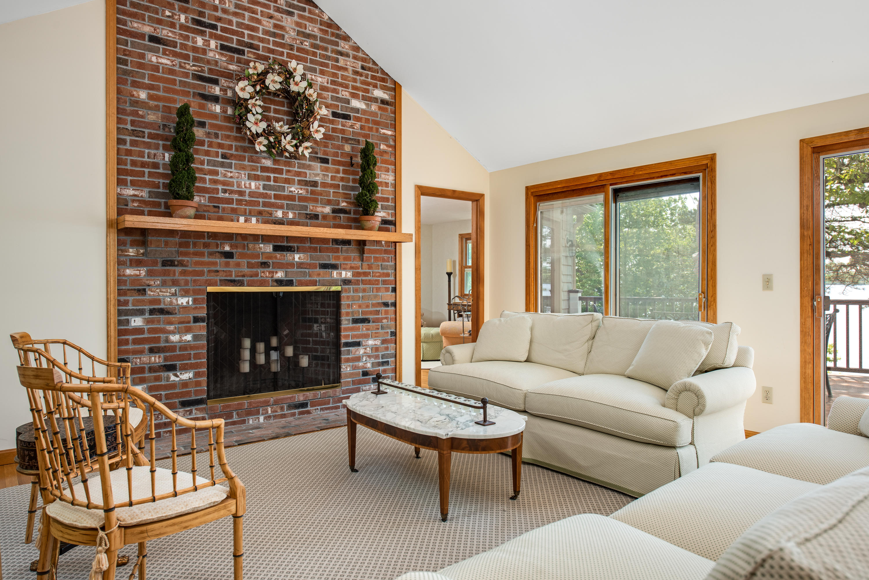 326 Holly Point Road Centerville, MA 02632 - Photo 7 of 30 a living room with furniture and a fireplace