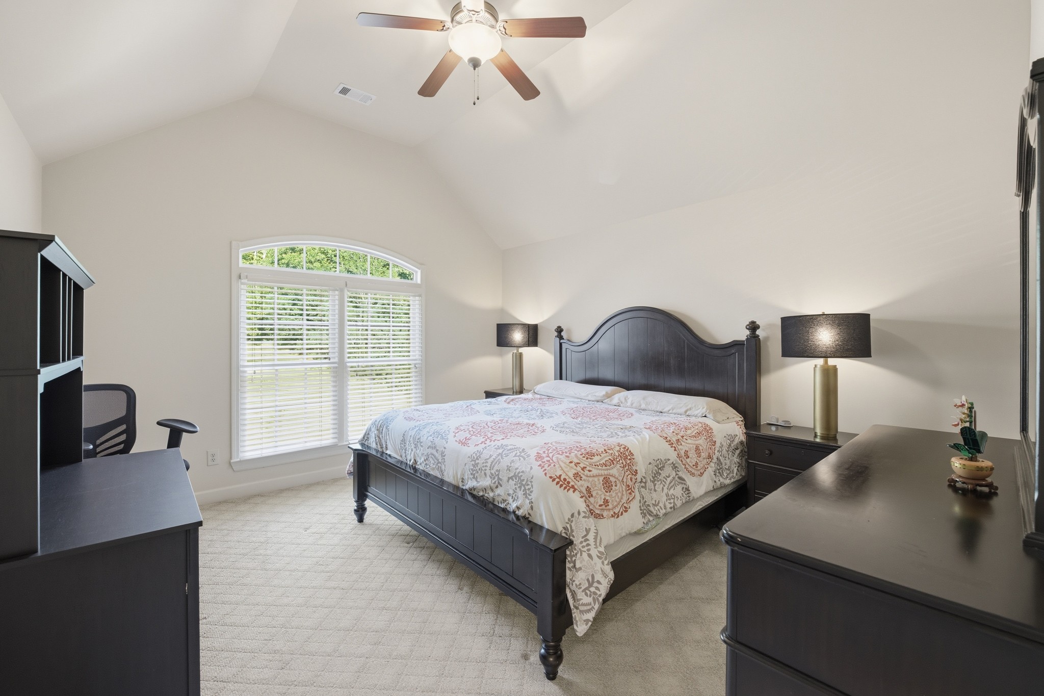 319 Hamlets End Way Franklin, TN 37067 - Photo 34 of 54 a bedroom with a bed and a flat tv screen on the dresser