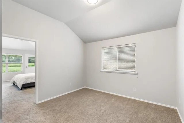 a view of a room with shelf on the wall