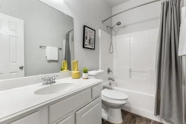a view of storage and utility room with wooden floor