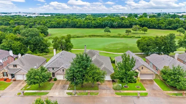 a view of a patio with a table chairs and a backyard