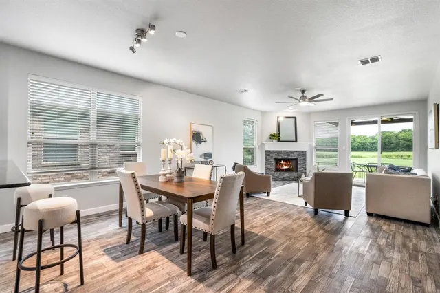 a kitchen with stainless steel appliances granite countertop a stove top oven a sink and dishwasher